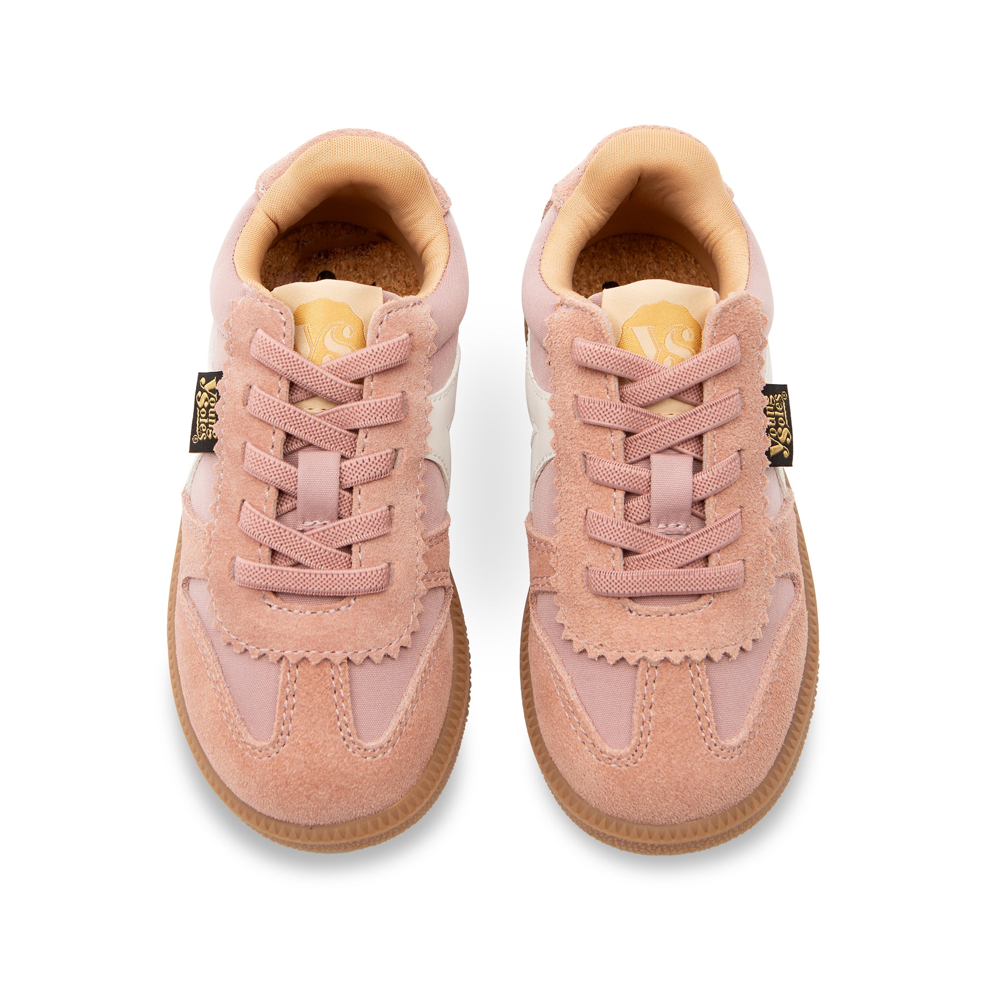 Pair of Brooking pink children's sneakers with brown soles on a white background